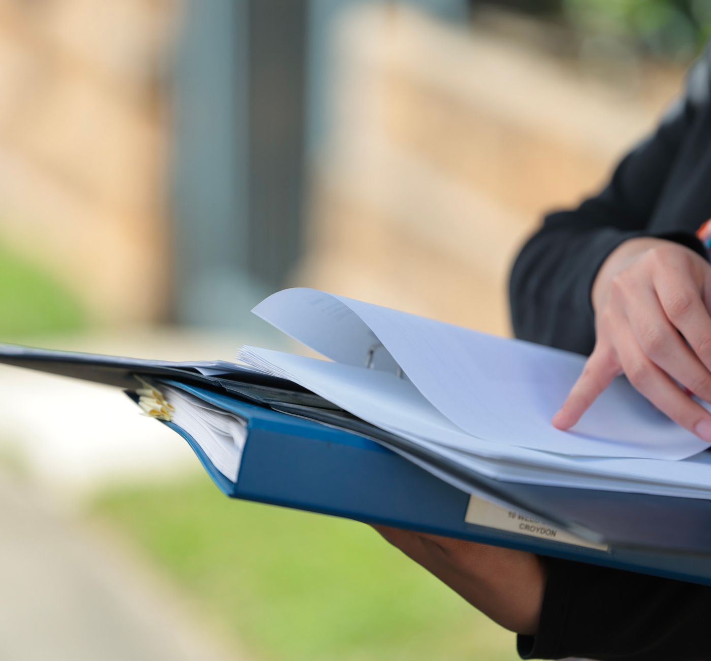 Agent reviewing a property folder