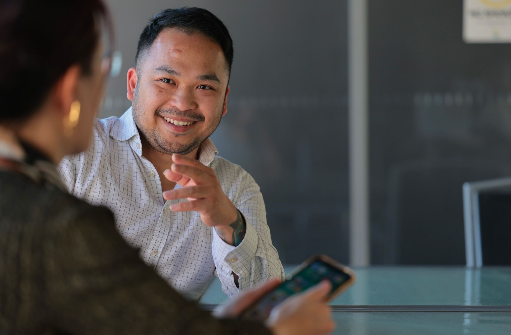 Eden property manager smiling during a client meeting