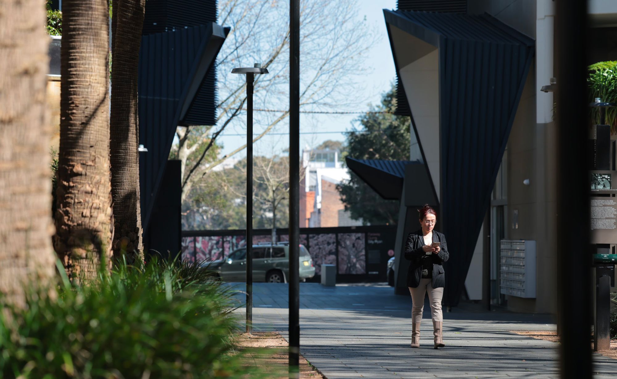 Property manager walking through an apartment courtyard