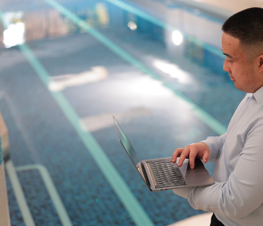 Eden building manager working on a laptop